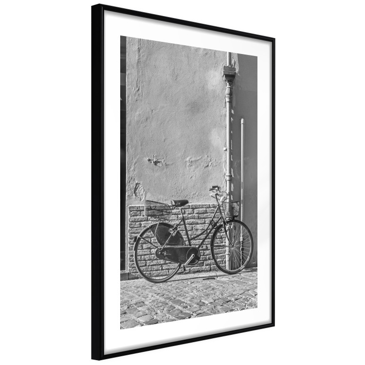 Wall Poster Old Italian Bicycle - black and white shot with a view of a stone street 117784 additionalImage 11