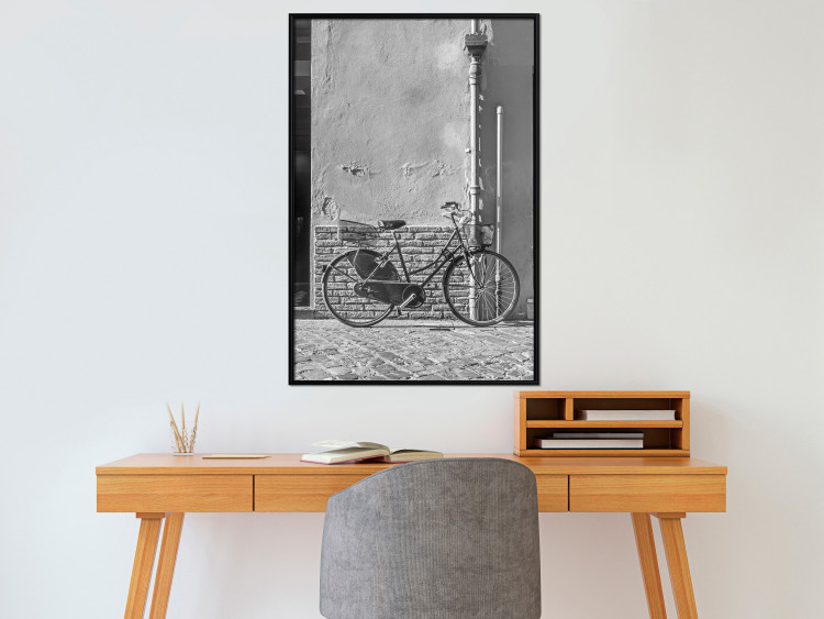 Wall Poster Old Italian Bicycle - black and white shot with a view of a stone street 117784 additionalImage 3