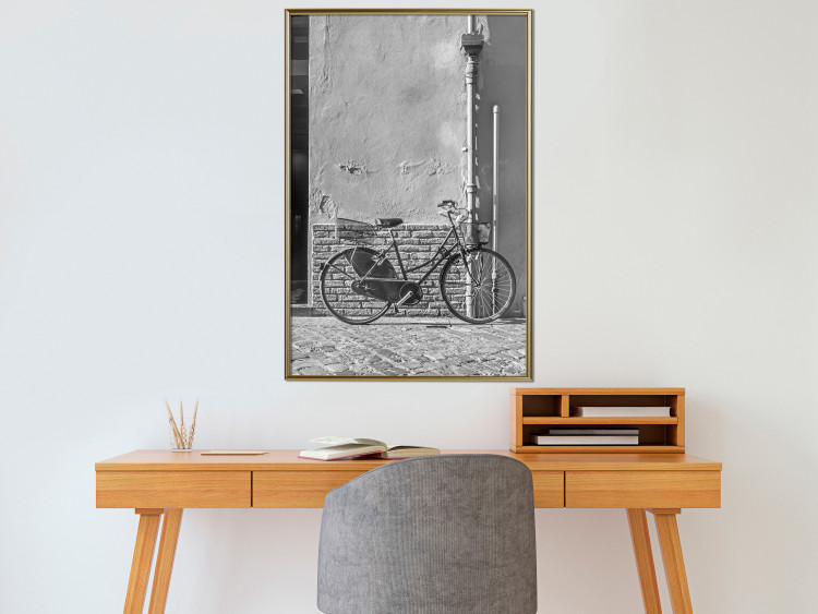 Wall Poster Old Italian Bicycle - black and white shot with a view of a stone street 117784 additionalImage 7