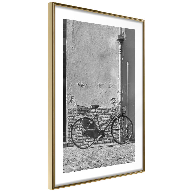 Wall Poster Old Italian Bicycle - black and white shot with a view of a stone street 117784 additionalImage 6