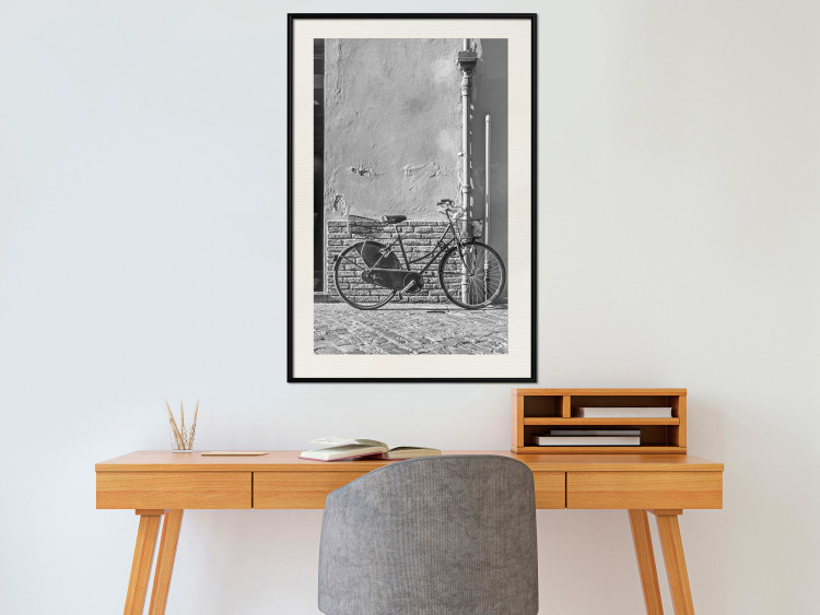 Wall Poster Old Italian Bicycle - black and white shot with a view of a stone street 117784 additionalImage 22