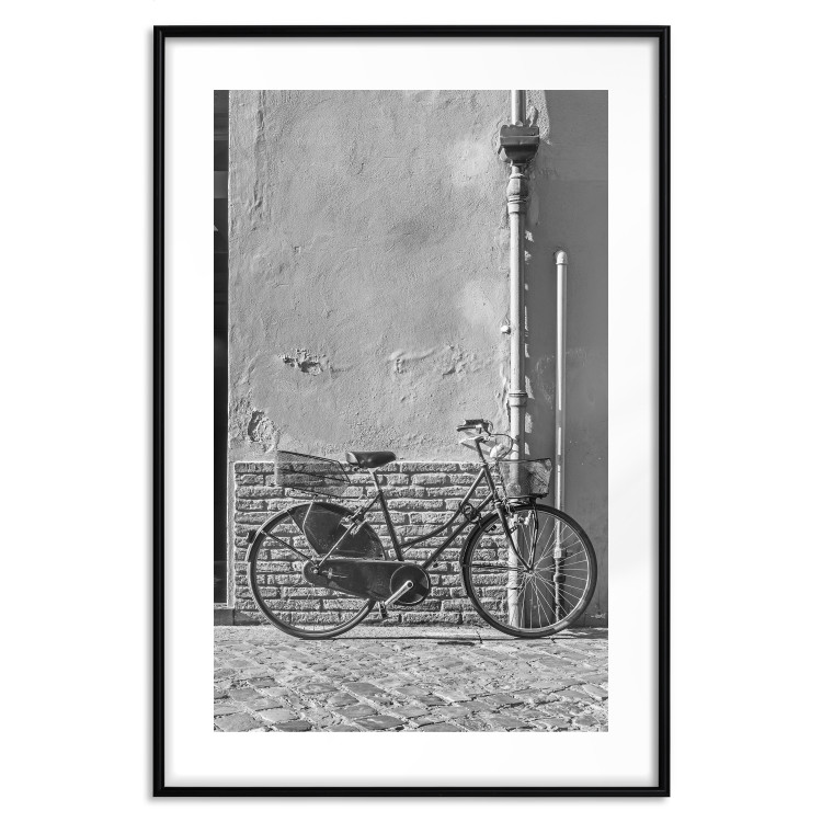 Wall Poster Old Italian Bicycle - black and white shot with a view of a stone street 117784 additionalImage 15