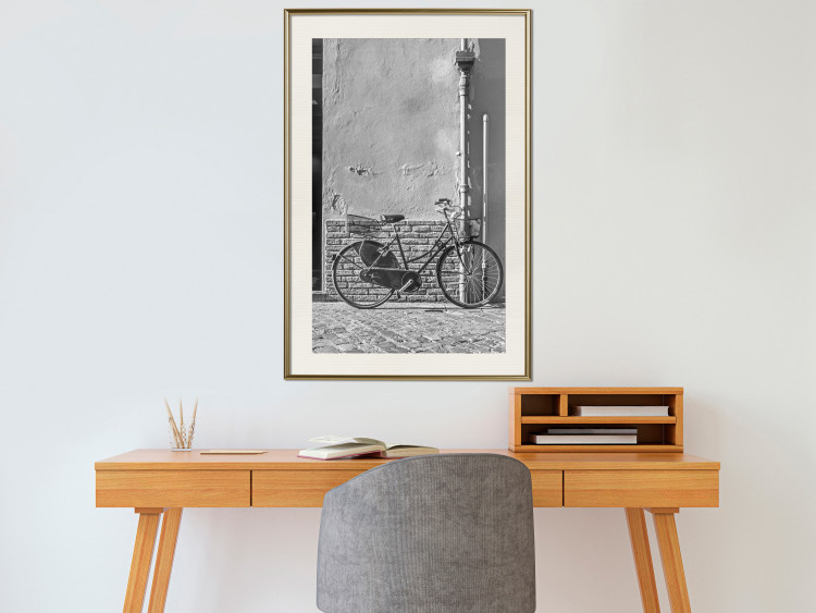 Wall Poster Old Italian Bicycle - black and white shot with a view of a stone street 117784 additionalImage 21