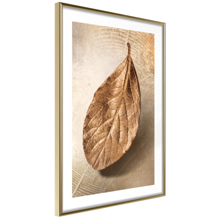 Poster Golden Lightness - golden leaf with distinct texture on a beige background 127394 additionalImage 9