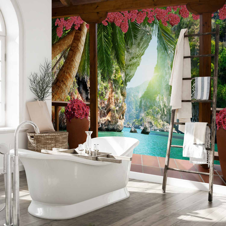 Wall Mural Tropical view - landscape with turquoise water surrounded by palm trees and flowers 129105 additionalImage 8