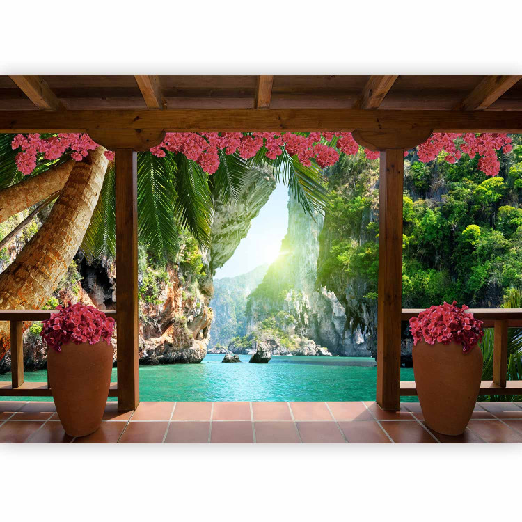 Wall Mural Tropical view - landscape with turquoise water surrounded by palm trees and flowers 129105 additionalImage 1