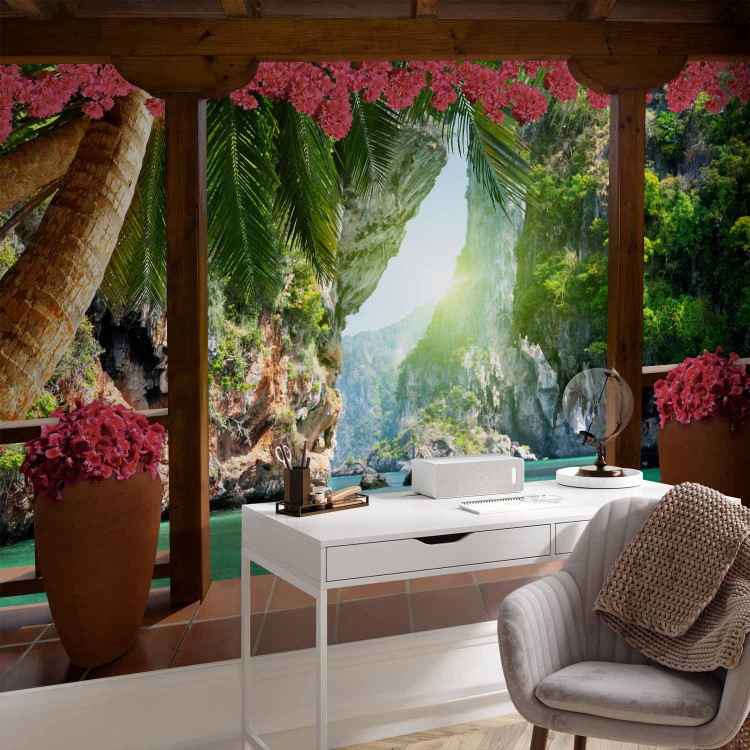 Wall Mural Tropical view - landscape with turquoise water surrounded by palm trees and flowers 129105 additionalImage 4