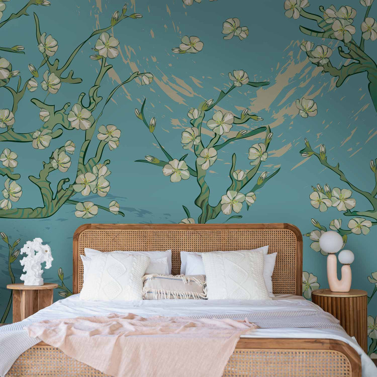 Wall Mural Flowers of Asia - blooming almond tree flowers on a blue background 142435 additionalImage 2