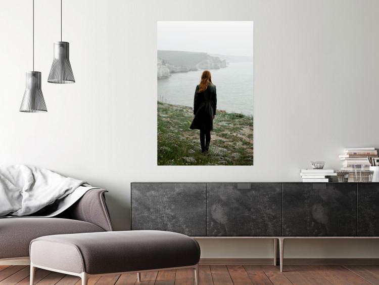 Wall Poster What Now? - landscape of a woman dressed in green against the sea and rocks 130295 additionalImage 2