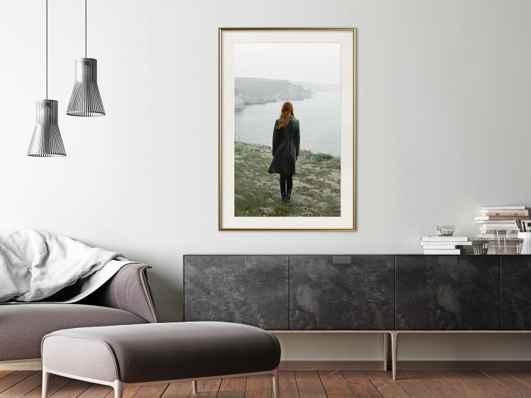 Wall Poster What Now? - landscape of a woman dressed in green against the sea and rocks 130295 additionalImage 18