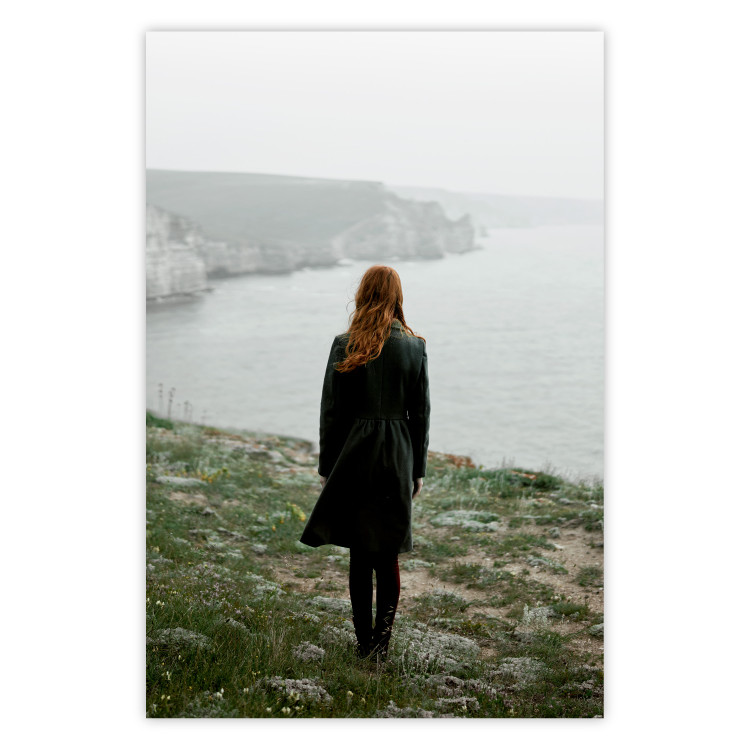 Wall Poster What Now? - landscape of a woman dressed in green against the sea and rocks 130295
