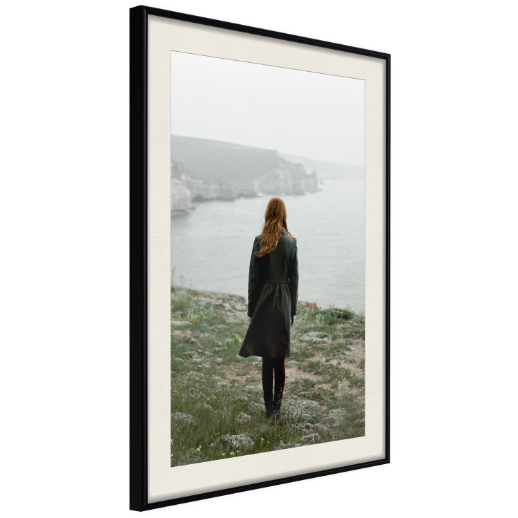Wall Poster What Now? - landscape of a woman dressed in green against the sea and rocks 130295 additionalImage 2