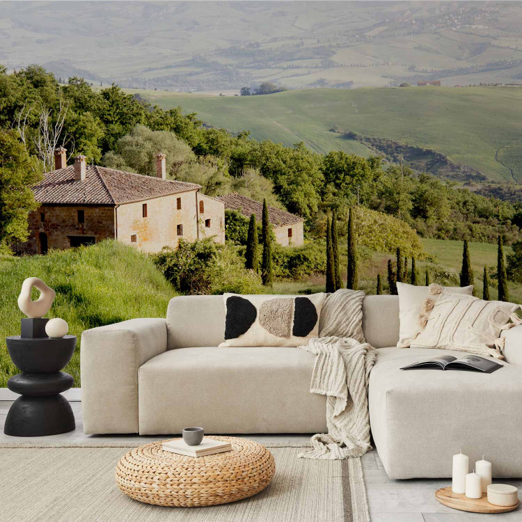 Wall Mural Under the sun of Tuscany - hillside landscape with trees in Italy with a house 97316