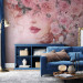 Wall Mural Lady in flowers - portrait of a woman's face draped in pink flowers 135026