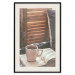 Wall Poster Mug of Memories - open book with tea against wooden doors 124456 additionalThumb 18