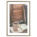 Wall Poster Mug of Memories - open book with tea against wooden doors 124456 additionalThumb 14