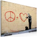 Canvas Art Print Peaceful Doctor (Banksy) - street art of a man on a brick wall 132476 additionalThumb 2