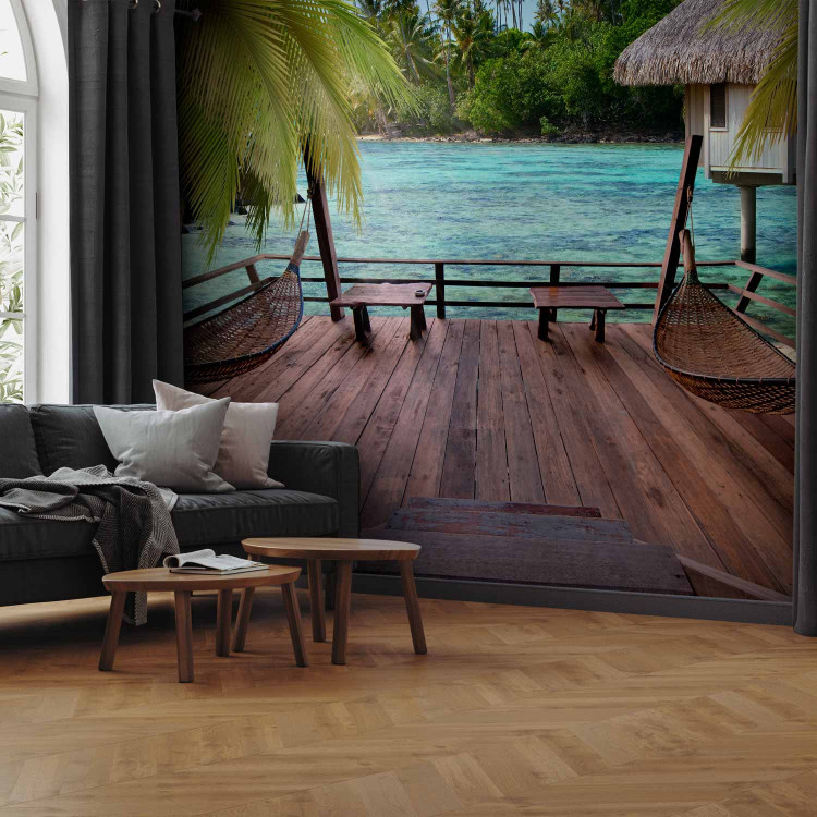 Wall Mural Tropical Landscape - Turquoise water with palm trees and wooden cottages 61707