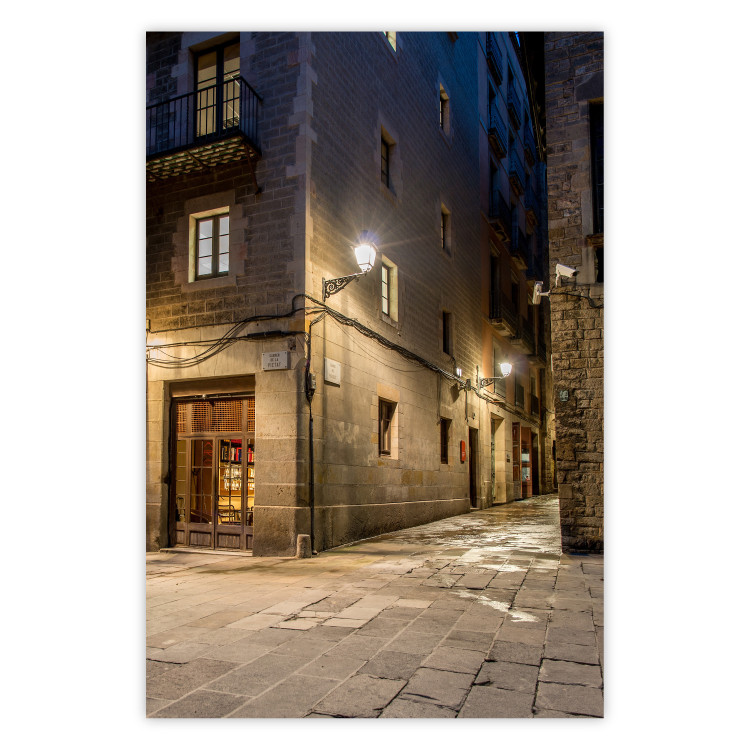 Poster Charming Alley - illuminated architecture of stone buildings at night 123617