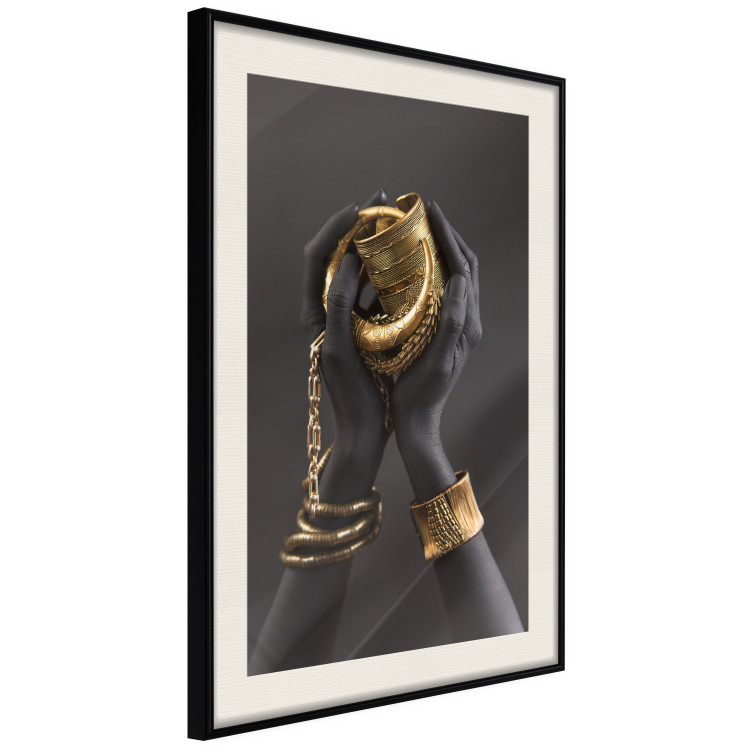 Poster Gold of the Desert - black hands with golden items on a dark background 130517 additionalImage 2