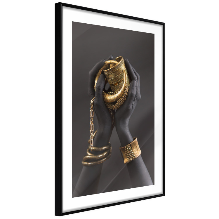 Poster Gold of the Desert - black hands with golden items on a dark background 130517 additionalImage 6