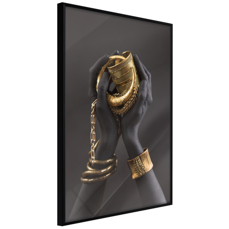 Poster Gold of the Desert - black hands with golden items on a dark background 130517 additionalImage 11