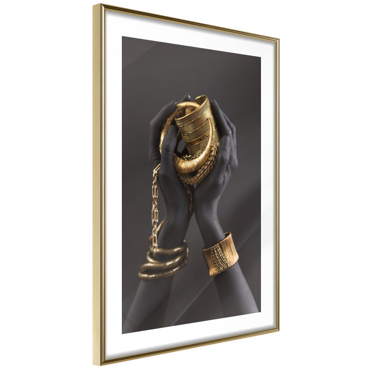 Poster Gold of the Desert - black hands with golden items on a dark background 130517 additionalImage 9