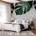 Wall Mural Face of monstera- composition with green leaves and concrete wall 138817 additionalThumb 2