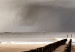 Wall Poster Perspective of Hope - beach landscape with poles against dark clouds 138037 additionalThumb 7