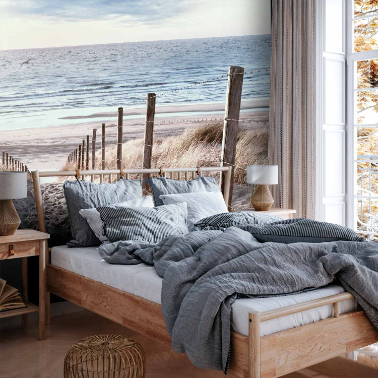 Wall Mural Windy sand - landscape with beach and calm sea at sunset 143947 additionalImage 2