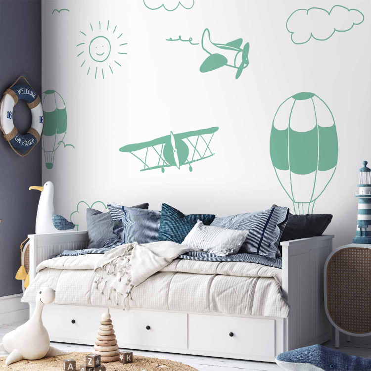 Wall Mural Sky Flight - Drawn Planes on a Background of a Green Sky With Clouds 145147 additionalImage 8