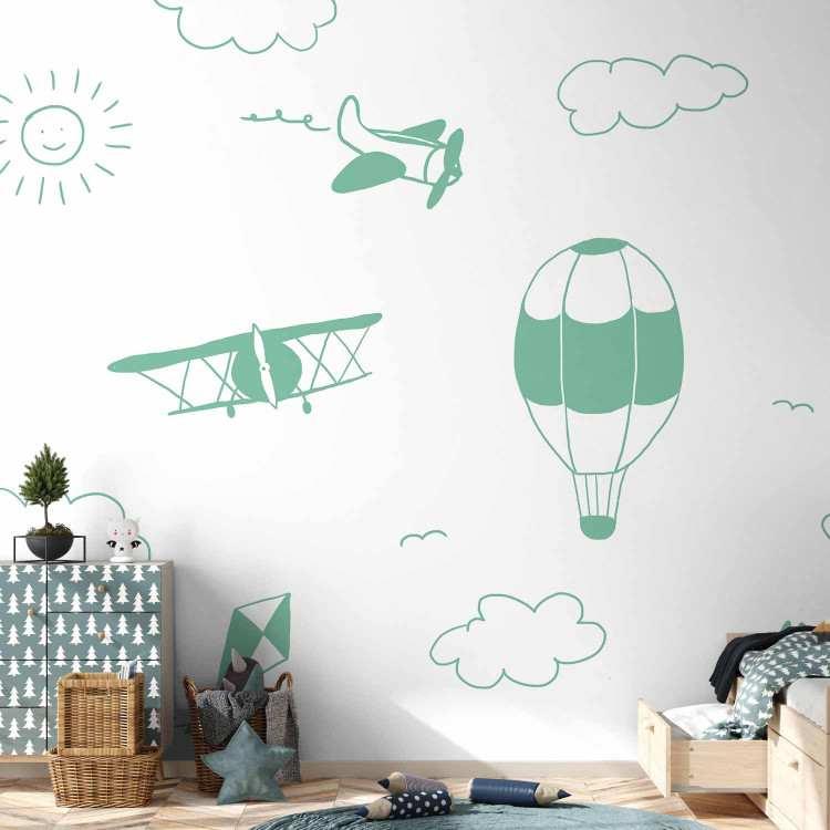 Wall Mural Sky Flight - Drawn Planes on a Background of a Green Sky With Clouds 145147 additionalImage 4