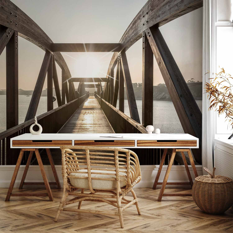 Wall Mural Bridge over the river - urban architectural landscape with a wooden bridge over the river with the sun in the background 74547 additionalImage 4