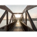 Wall Mural Bridge over the river - urban architectural landscape with a wooden bridge over the river with the sun in the background 74547 additionalThumb 1
