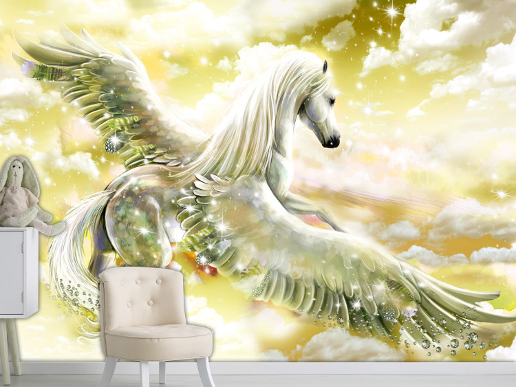 Photo Wallpaper Pegasus - magical motif of a flying horse in clouds in yellow designs 107257