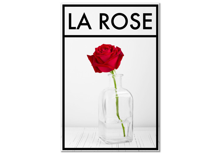 Canvas Art Print Rose - intense red rose flower in a vase on a pale gray background with a black frame and an inscription in French perfect for a room or dining room 123557