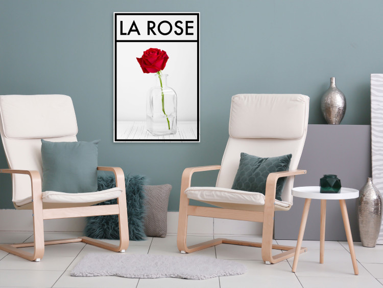 Canvas Art Print Rose - intense red rose flower in a vase on a pale gray background with a black frame and an inscription in French perfect for a room or dining room 123557 additionalImage 3