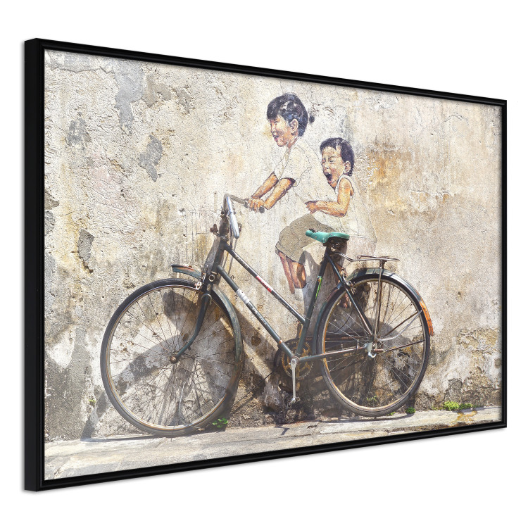 Poster Carefree - retro black bicycle against a wall painted with children 130457 additionalImage 11