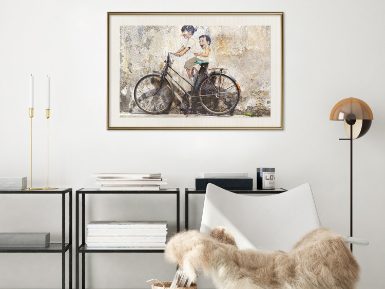 Poster Carefree - retro black bicycle against a wall painted with children 130457 additionalImage 22