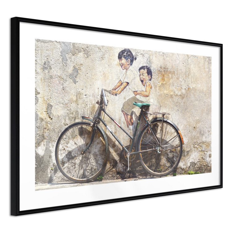 Poster Carefree - retro black bicycle against a wall painted with children 130457 additionalImage 14