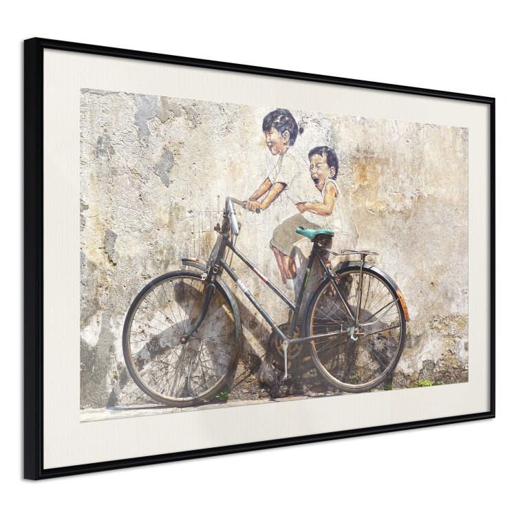 Poster Carefree - retro black bicycle against a wall painted with children 130457 additionalImage 5