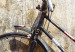 Poster Carefree - retro black bicycle against a wall painted with children 130457 additionalThumb 2