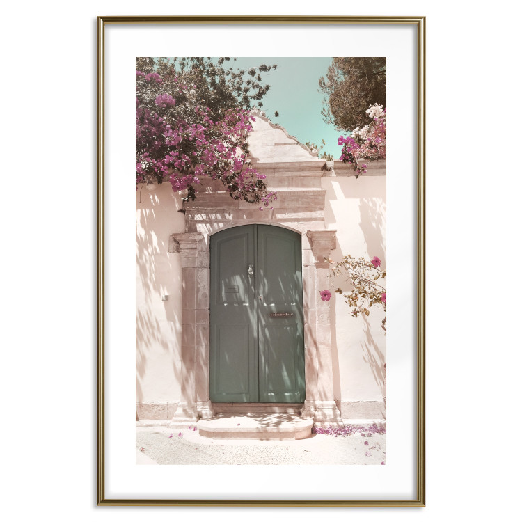 Wall Poster Charming Alley - architecture of a wall with a green entrance in the sunlight 135757 additionalImage 20