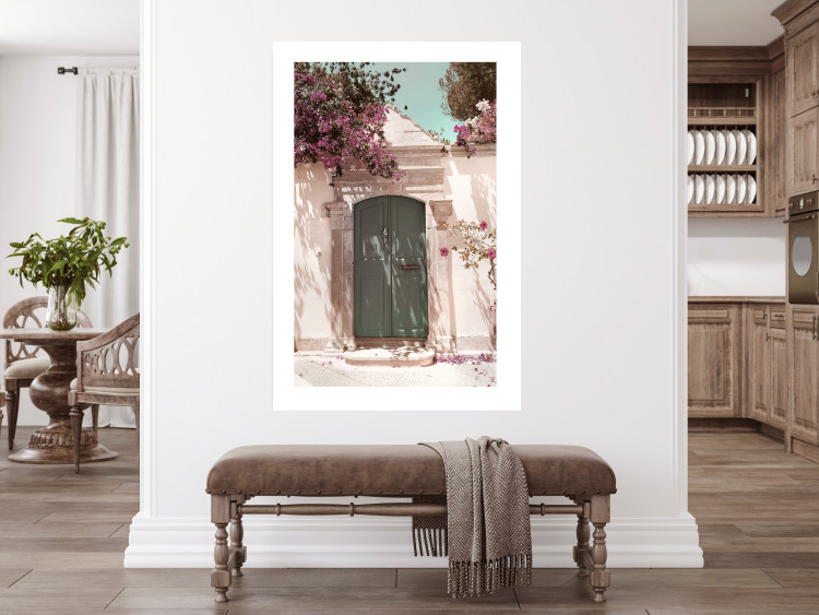 Wall Poster Charming Alley - architecture of a wall with a green entrance in the sunlight 135757 additionalImage 13