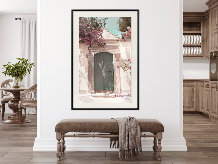 Wall Poster Charming Alley - architecture of a wall with a green entrance in the sunlight 135757 additionalImage 21