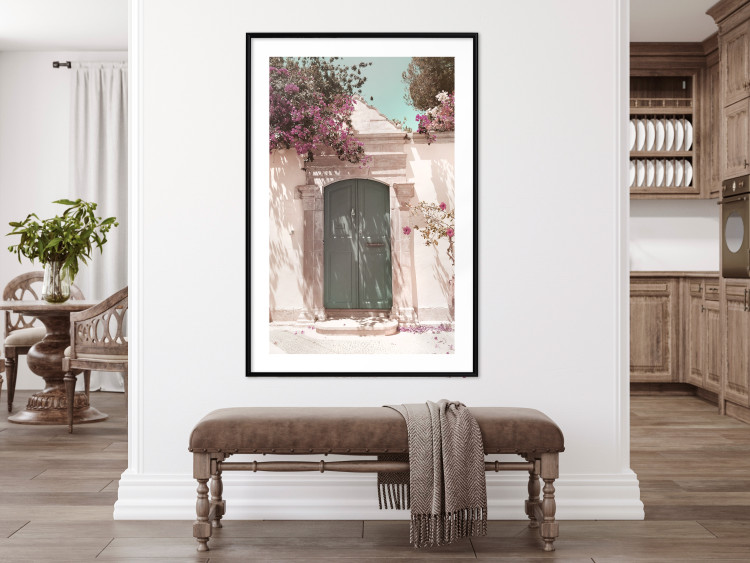 Wall Poster Charming Alley - architecture of a wall with a green entrance in the sunlight 135757 additionalImage 10