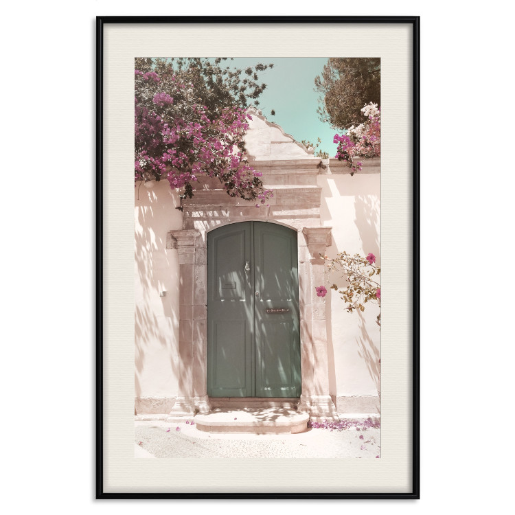Wall Poster Charming Alley - architecture of a wall with a green entrance in the sunlight 135757 additionalImage 26