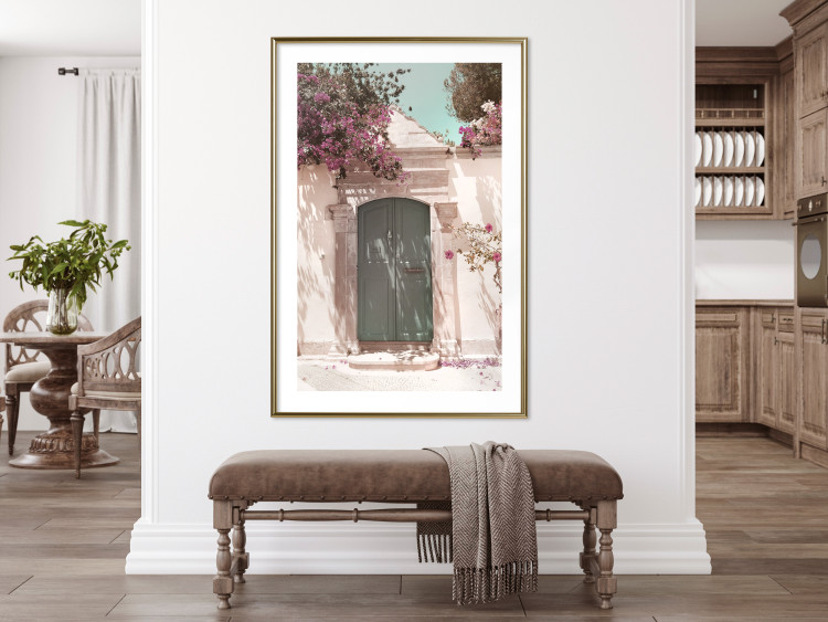 Wall Poster Charming Alley - architecture of a wall with a green entrance in the sunlight 135757 additionalImage 9