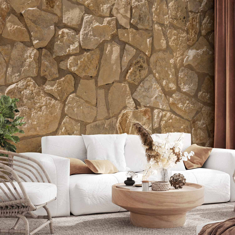 Photo Wallpaper Sunny monolith - composition with texture of stones in beige colour 91167