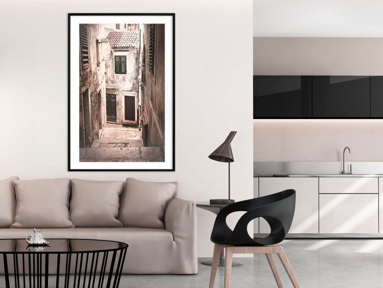Poster Retro Alley - urban architecture of a stone alleyway in sepia tone 128608 additionalImage 4
